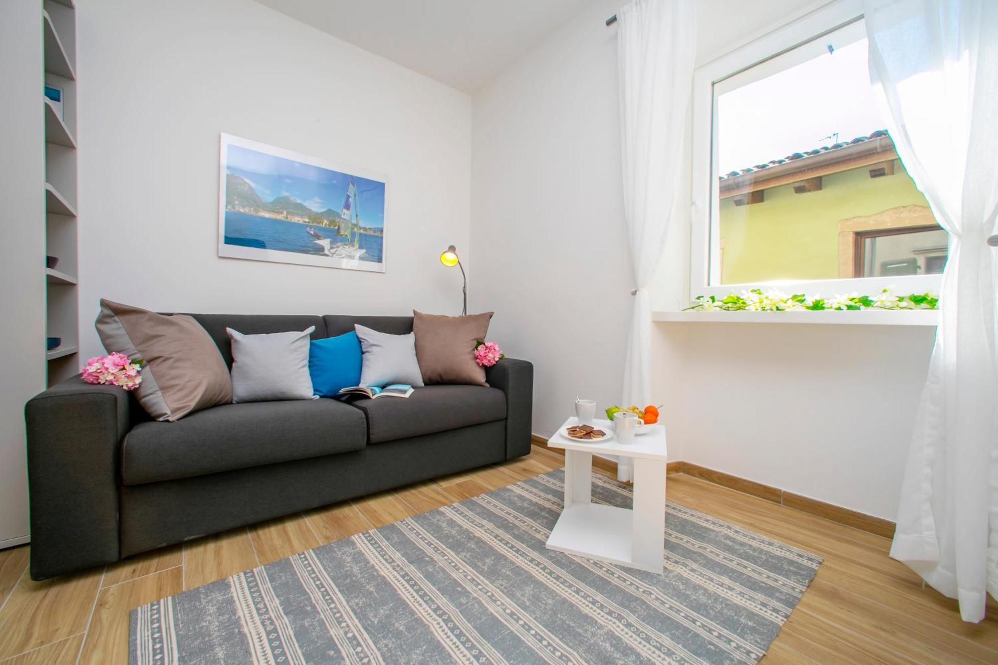 Nido Sui Tetti Di Riva Del Garda - Happy Rentals Dış mekan fotoğraf