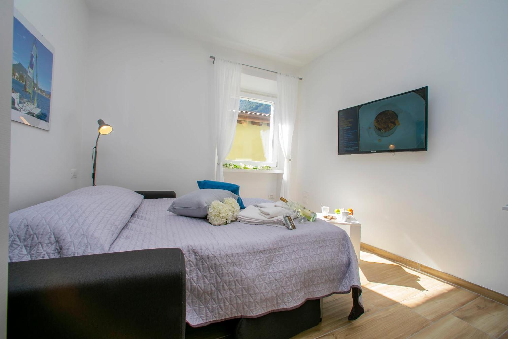 Nido Sui Tetti Di Riva Del Garda - Happy Rentals Dış mekan fotoğraf